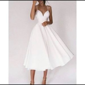 Beautiful white tea length dress, backless, with sweetheart neckline, size 6
